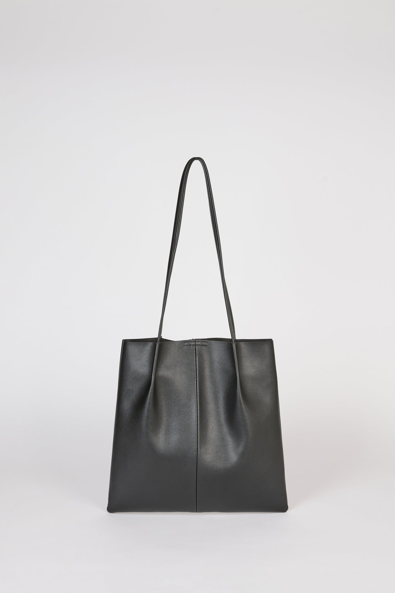 Black vegan leather pinched strap tote bag