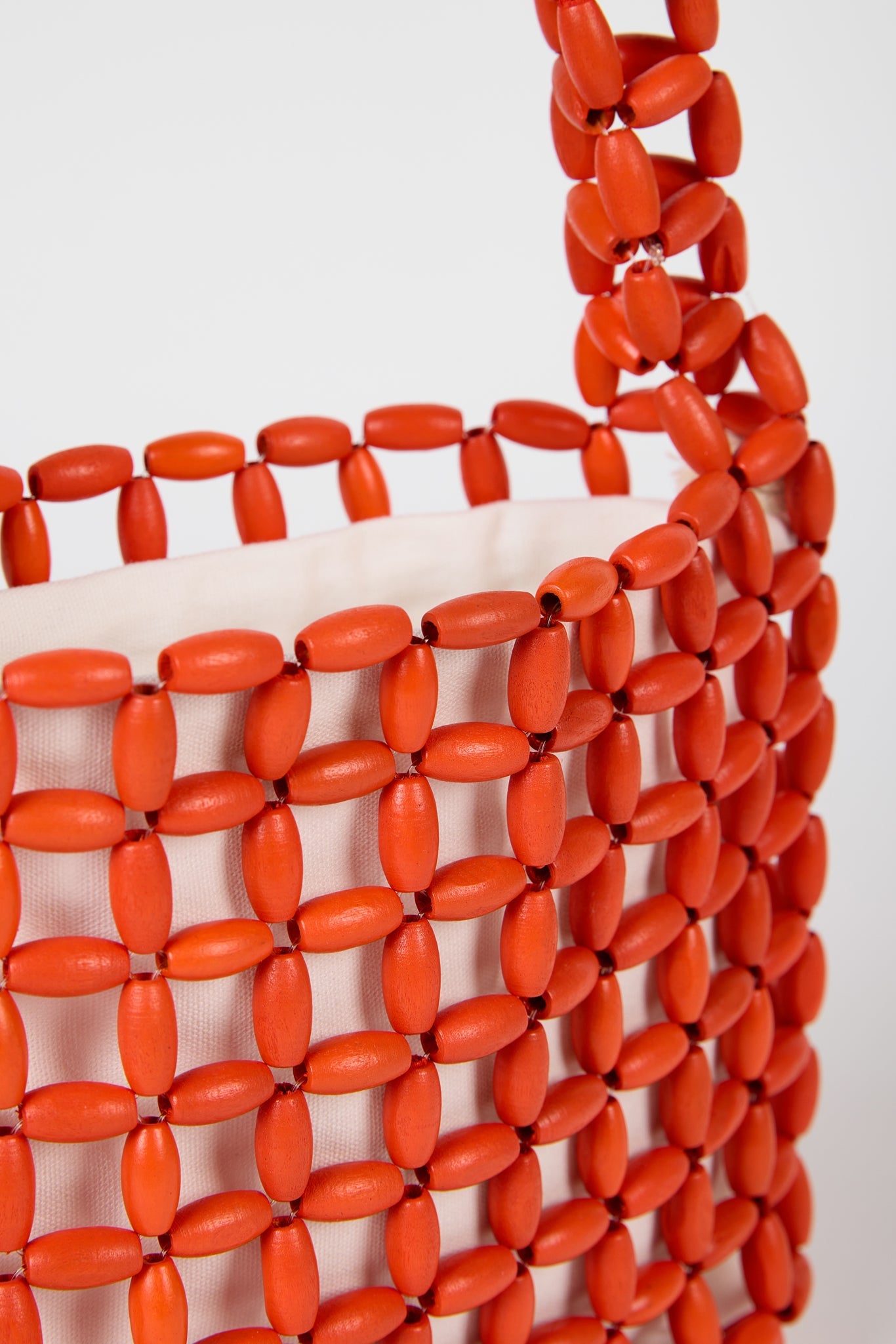 Bright orange wooden beaded mini shoulder bag