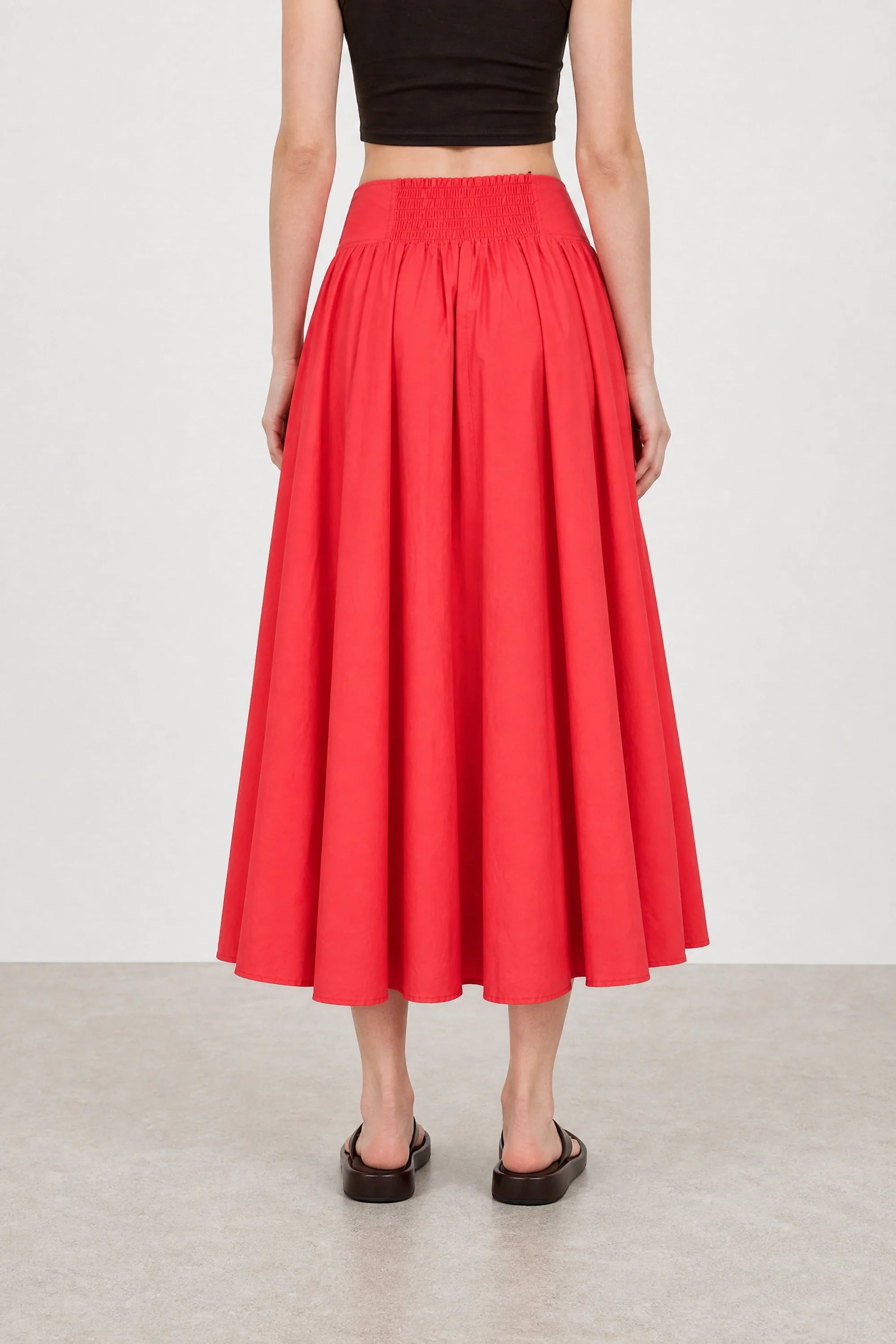 Bright red drop waist midi skirt