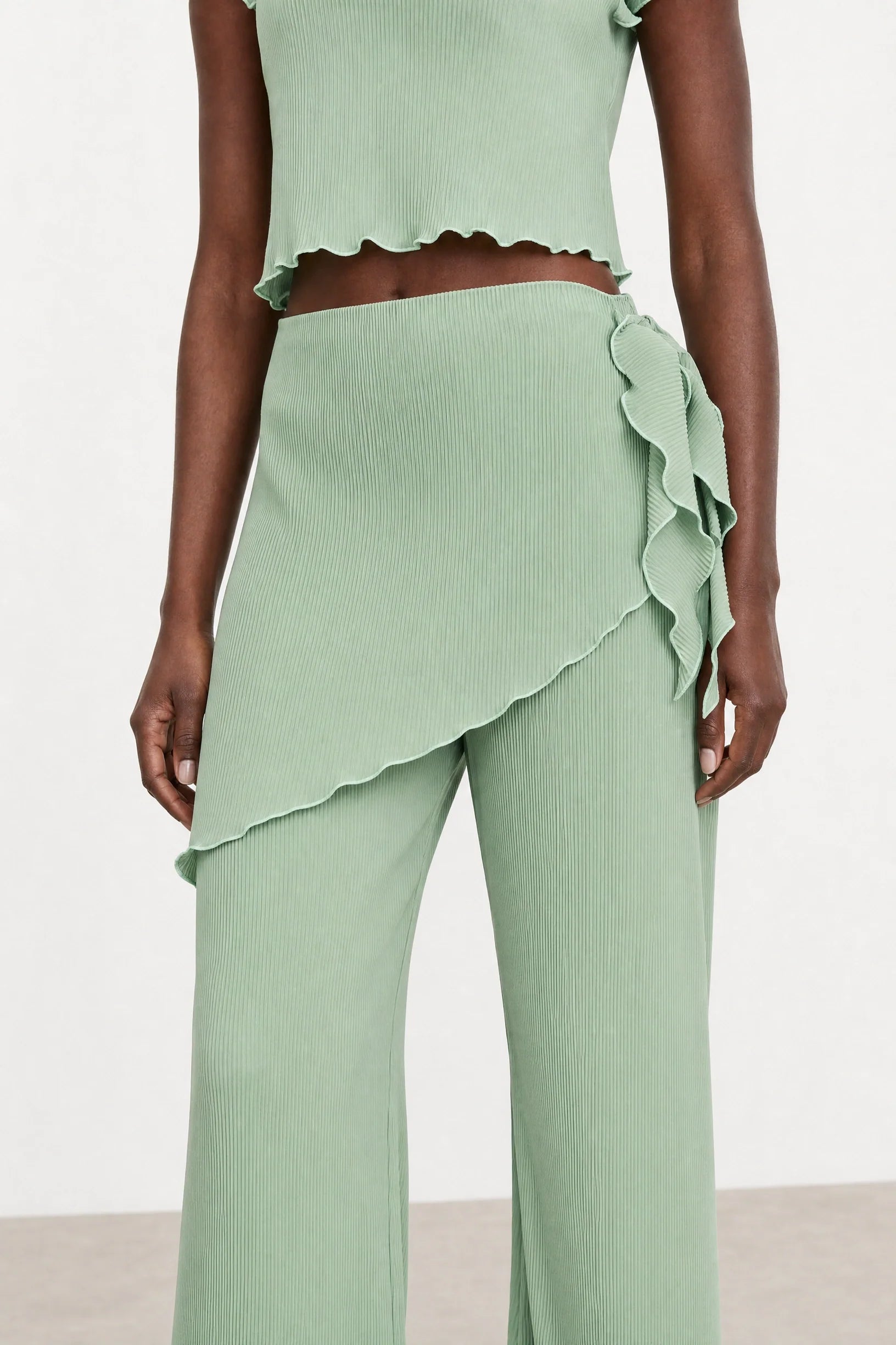 Green blue ribbed flare trousers