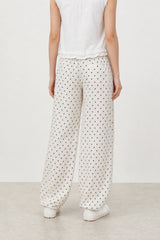 Ivory and black polka dot linen blend slouchy trousers