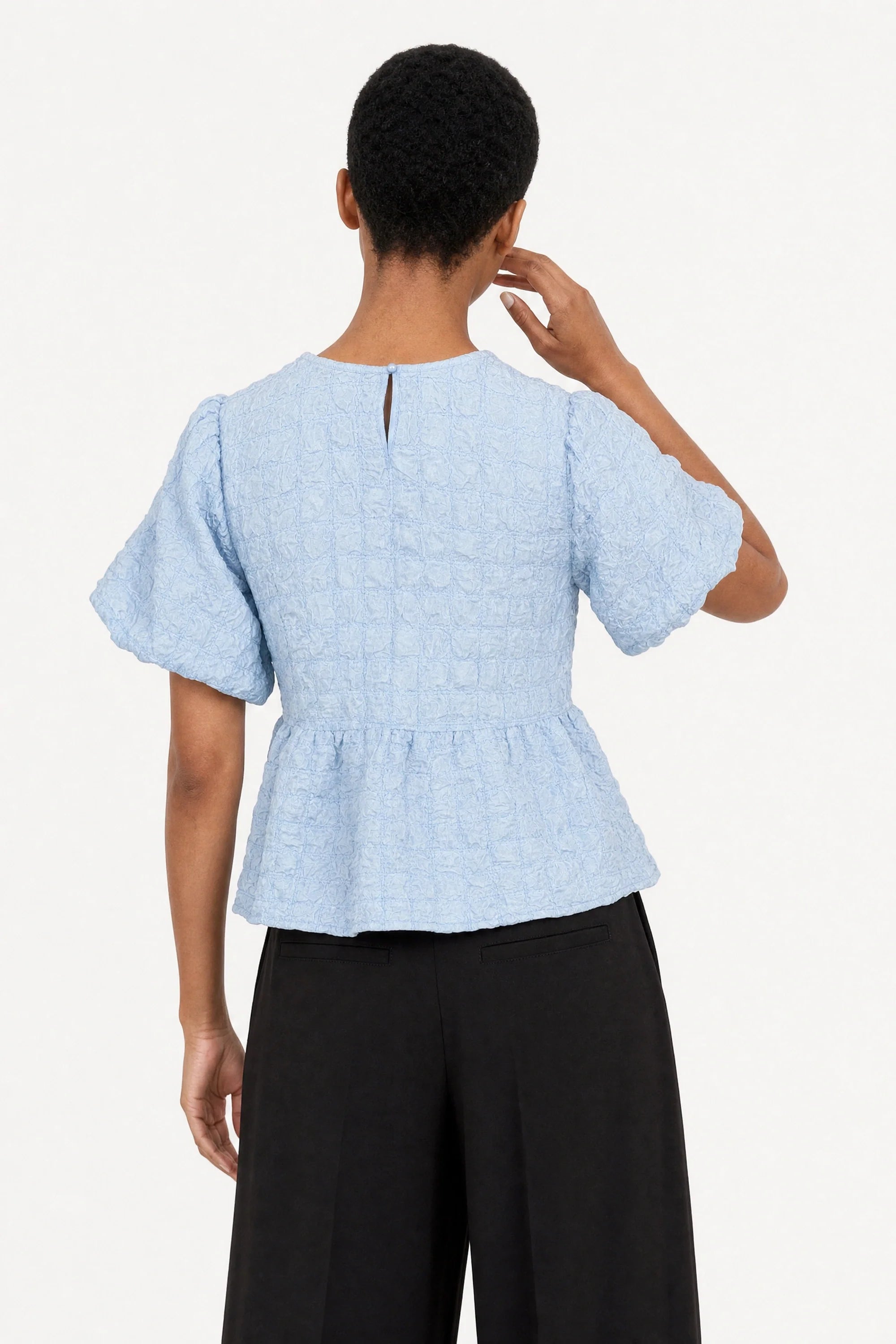 Light blue textured puff short sleeve tiered blouse