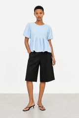 Light blue textured puff short sleeve tiered blouse