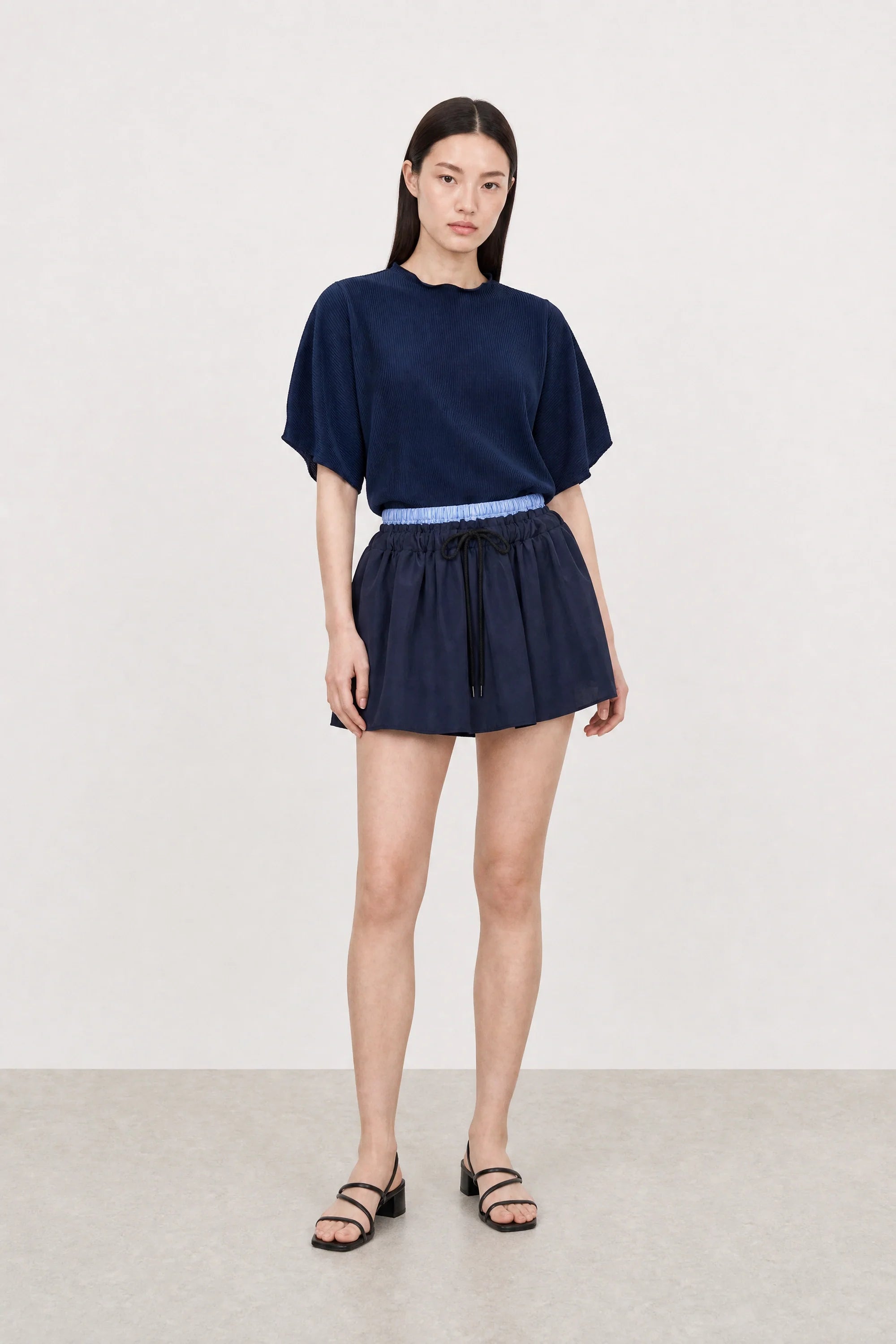 Navy blue ribbed mock neck blouson sleeve top