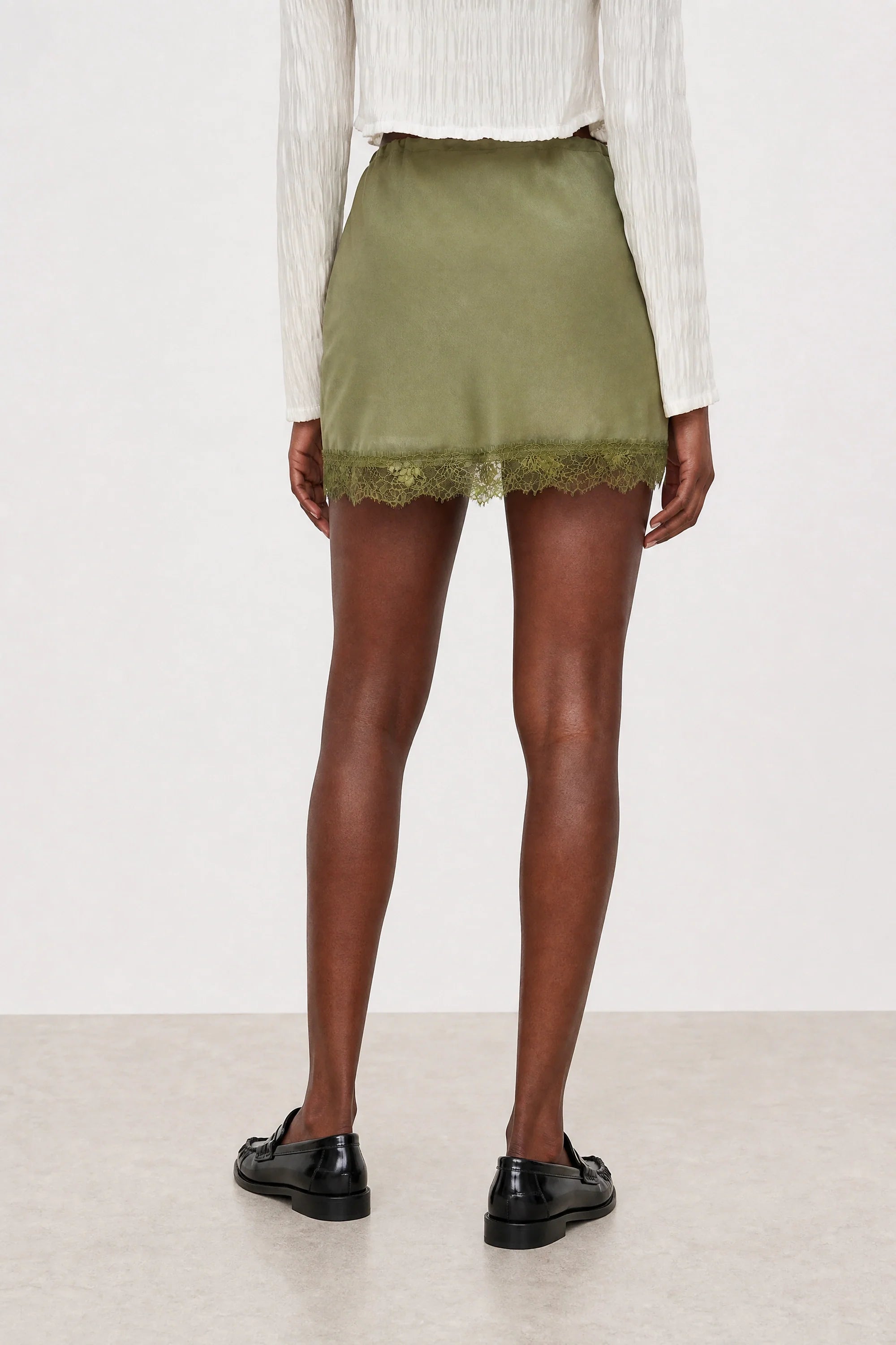 Olive green lace trim mini slip skirt