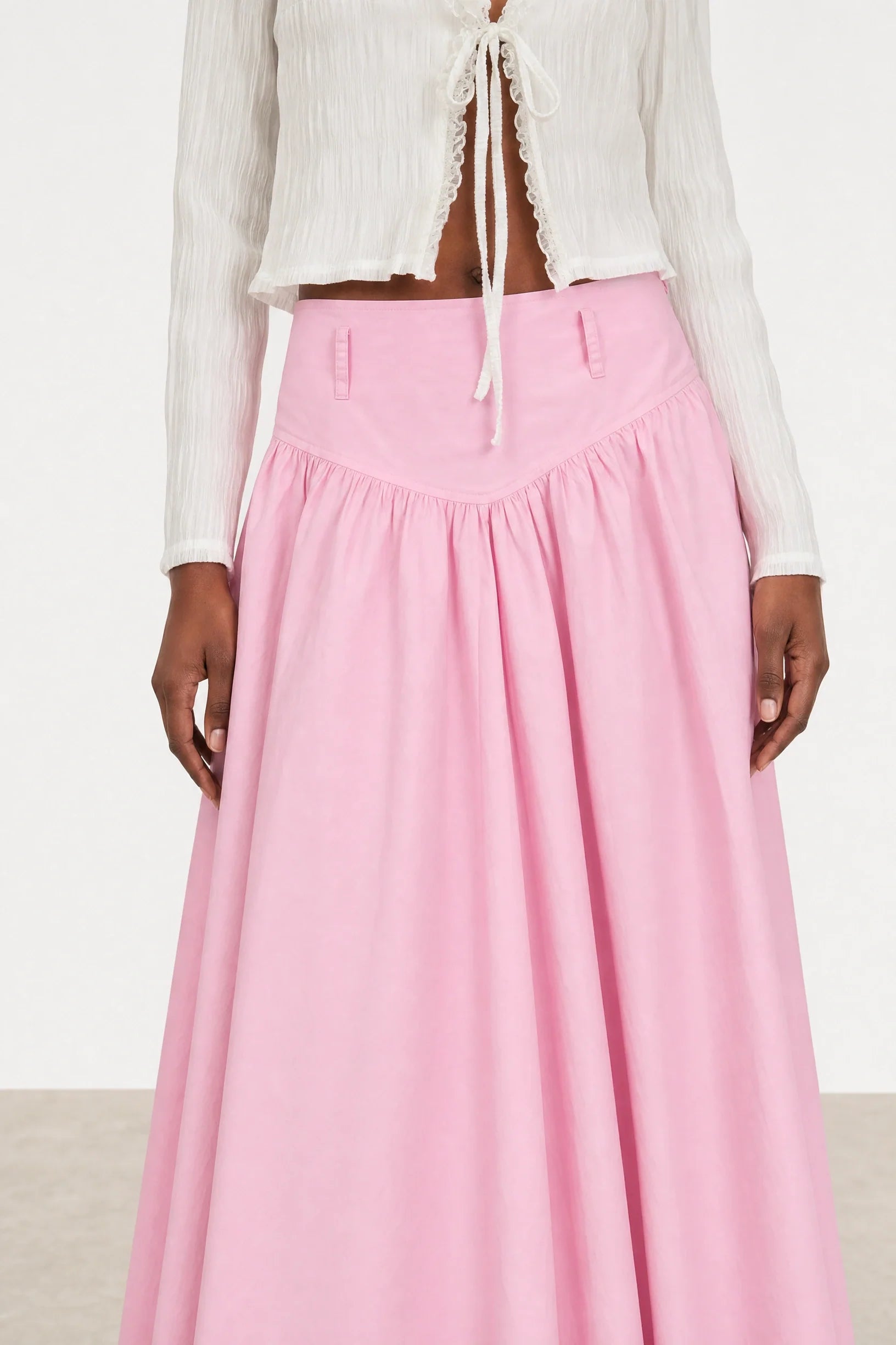 Pale pink drop waist midi skirt