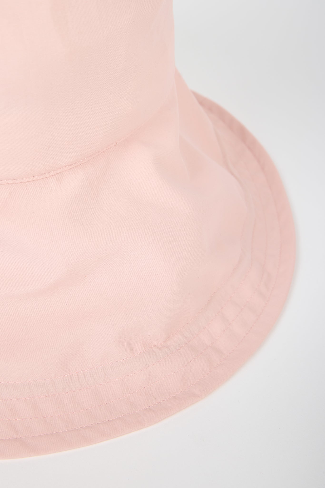 Pale pink nylon wide brim bucket hat