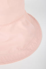 Pale pink nylon wide brim bucket hat