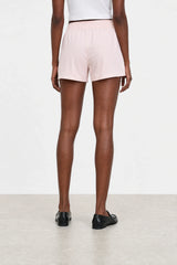 Pale pink vegan leather shorts