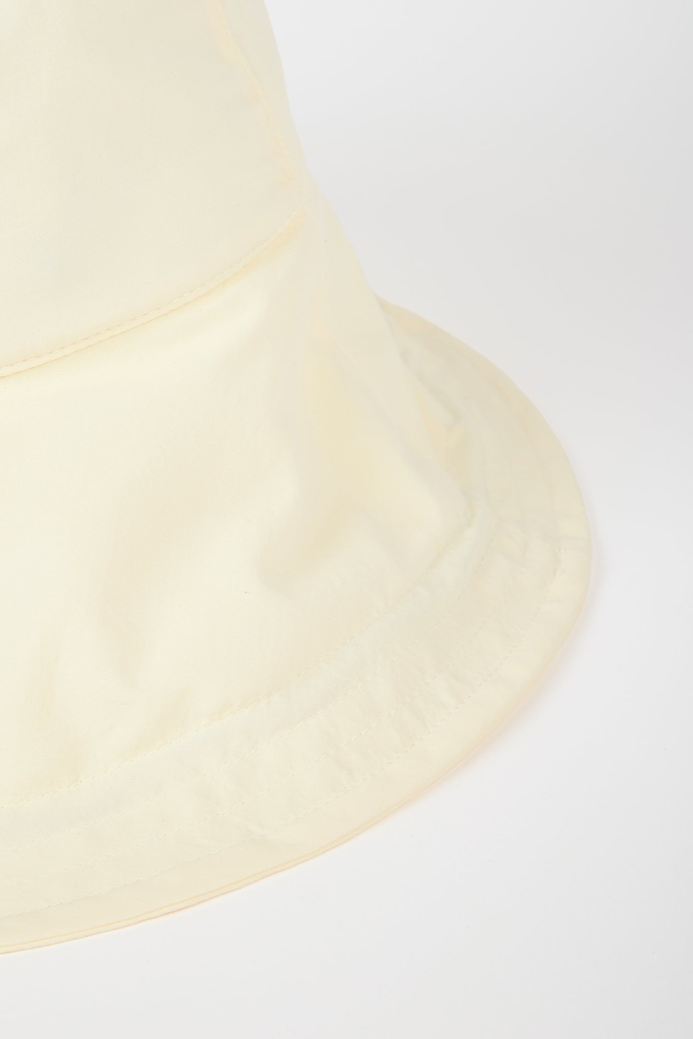 Pale yellow nylon wide brim bucket hat