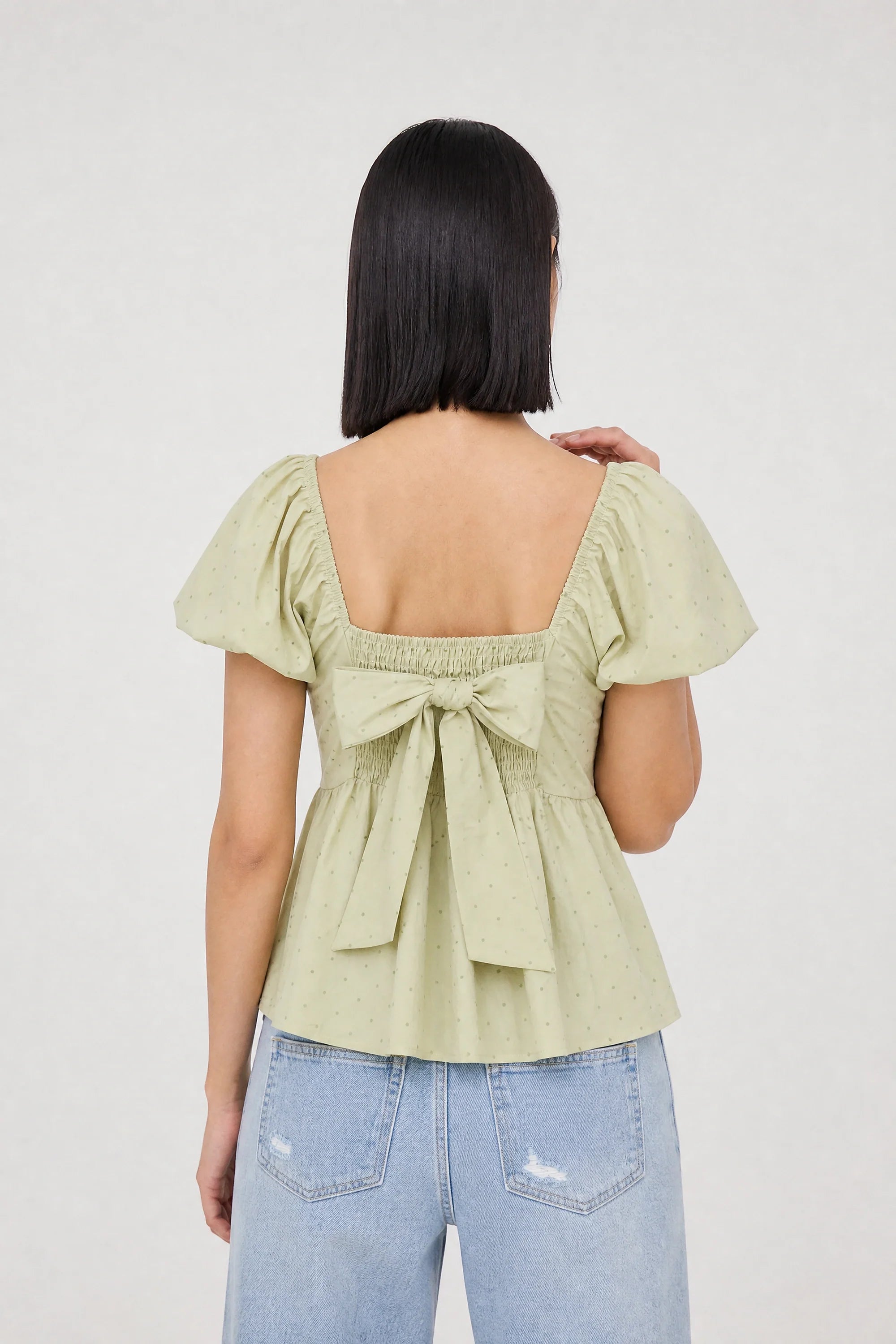 Sage green and olive polka dot ruched tie back top