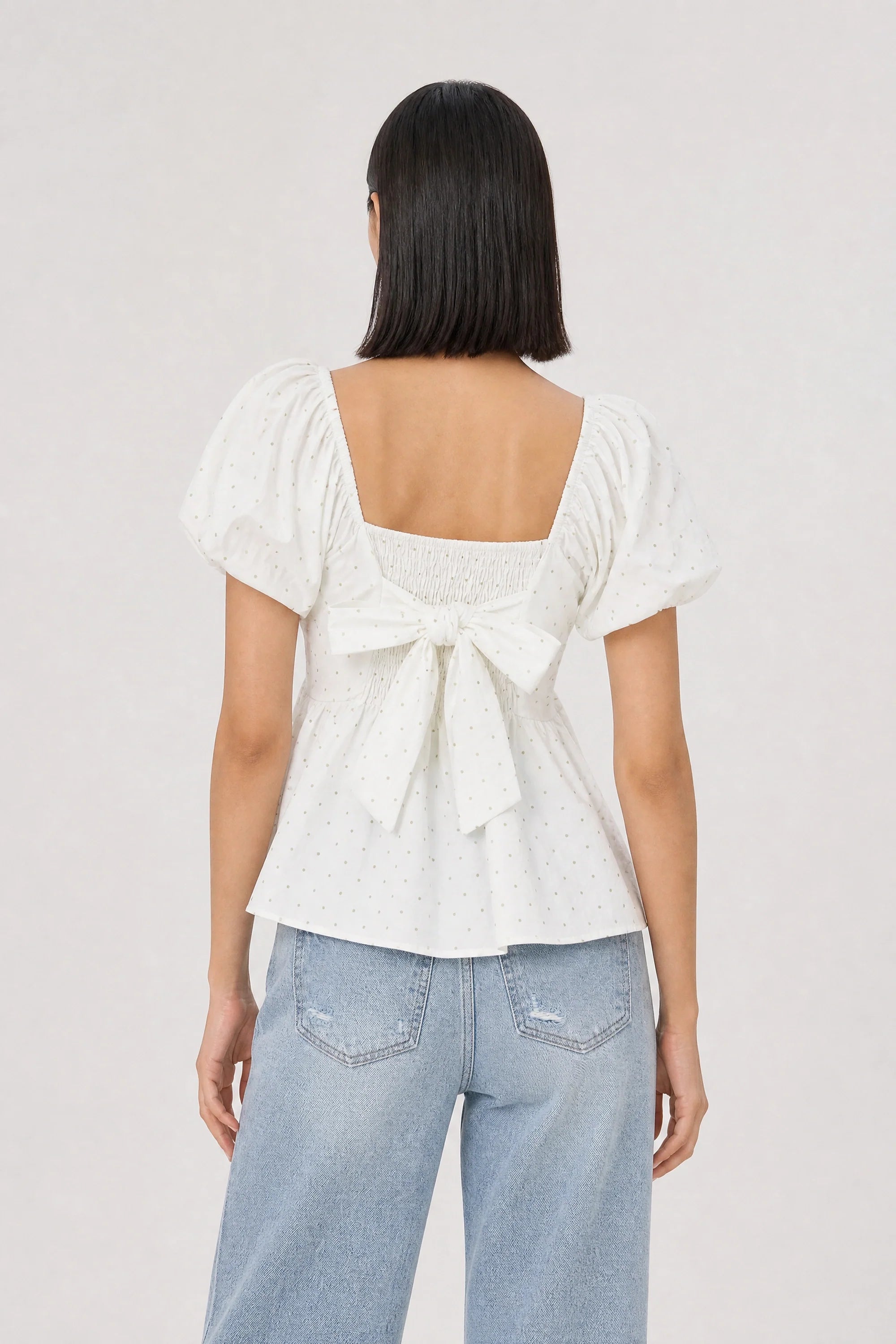 White and green polka dot ruched tie back top