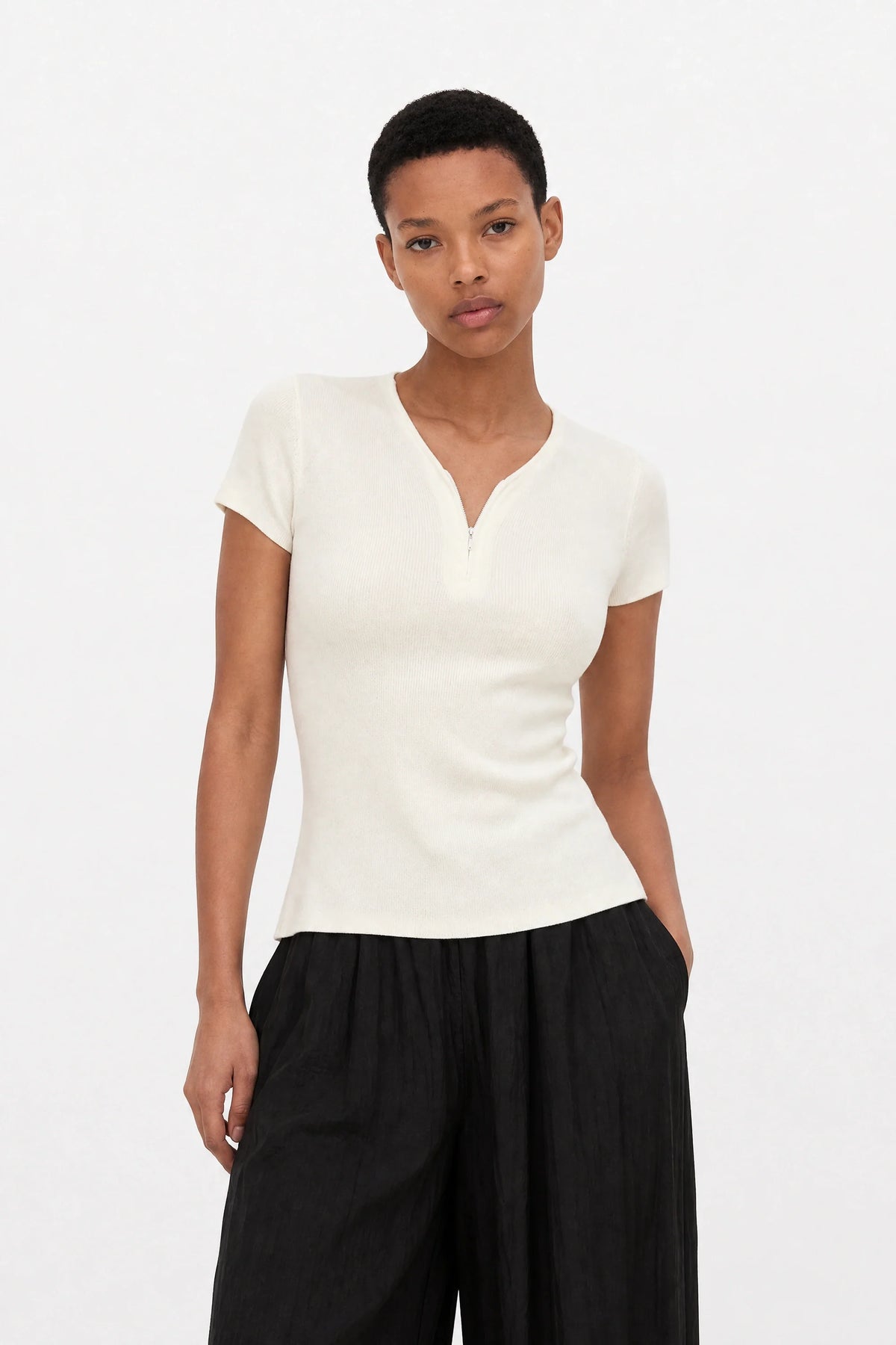 White ribbed zip front knit tee